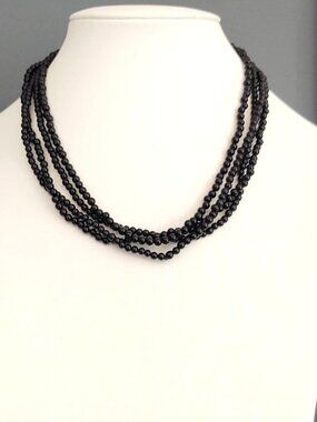 2 single strands of small black beaded necklaces